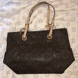 brown and tan Michael Kors tote bag